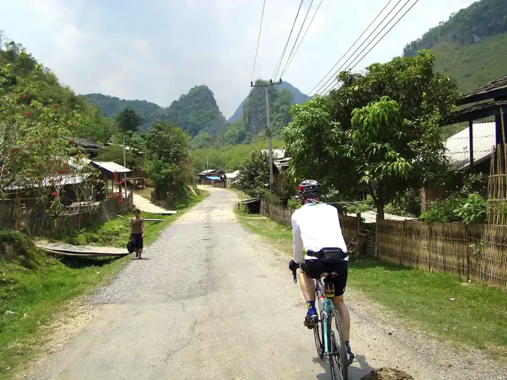 Road cyclist riding near border of Vietnam and Laos.